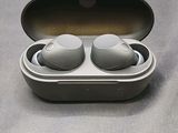 a pair of ear buds in a case on a table