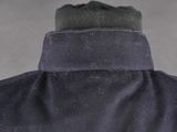 a close up of a man ' s jacket with a hat on