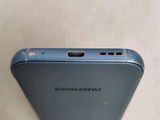 the back of a cell phone with a broken screen on a table