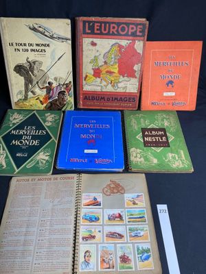 several books are lined up on a table with a black background
