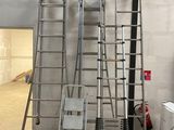 many ladders that are sitting in a room
