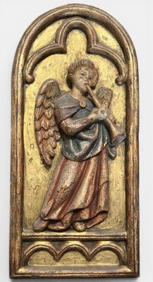 an antique brass plaque with an angel holding a trumpet