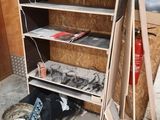 a shelf that has some tools on it in a room