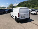 a white van that is parked in a parking lot