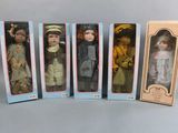 six boxed dolls of different sizes and colors are lined up in a row