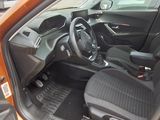the interior of a car with the door open showing the driver ' s seat