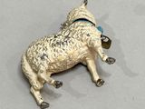 an image of a figurine of a sheep with a bell