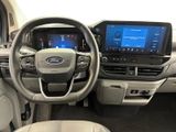 the interior of a car with a steering wheel, dashboard, and entertainment system