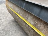 a close up of a road roller with a measuring tape on it