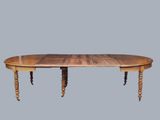 a large wooden table with two legs and a table top
