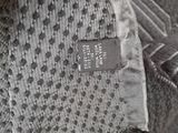a close up of a tie with a tag on it
