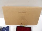 a box with a watch inside of it on a table