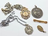a lot of silver and gold items on a white surface
