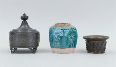 three different vases sitting next to each other on a table