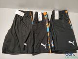 deux shorts Puma pour homme, un noir et un orange