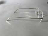 a pair of glasses sitting on a table next to a cell phone