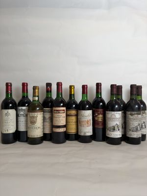 several bottles of wine are lined up in a row on a table