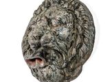 a statue of a lion head on a white background