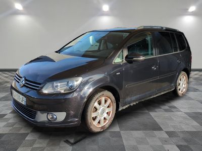 the grey van is parked in a room with a checkered floor
