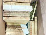 a box full of books that are sitting on the floor