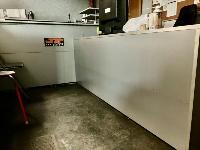 a man sitting at a counter in a restaurant