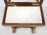 a small wooden box with a mirror on top of it