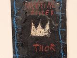 painting of a crown on a black piece of paper with writing on it