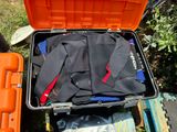 a suitcase full of scuba gear sitting on the ground