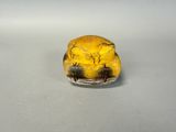 a small glass object that is sitting on a table