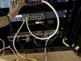 many wires that are connected to a computer in a room
