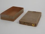 two boxes that are sitting next to each other on a table