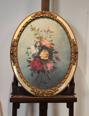une photo d'un tableau représentant des fleurs posé sur un chevalet