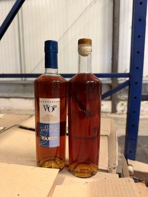 two bottles of wine sitting on a table