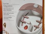 packaging of a foot spa machine sitting on top of a counter