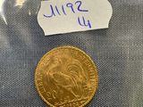 a close up of a coin in a plastic bag on a table