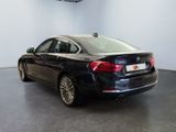 the bmw 6 series saloone is parked in a showroom