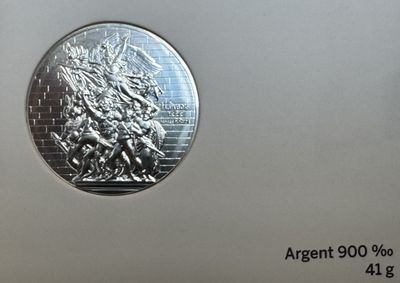 une image représentant une pièce d'argent sur laquelle figure un homme à cheval