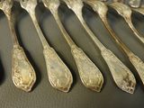 a lot of spoons that are on a table