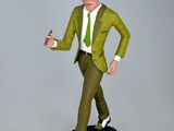 figurine of a man in a green suit and hat holding a gun