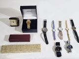a lot of watches that are sitting on a table