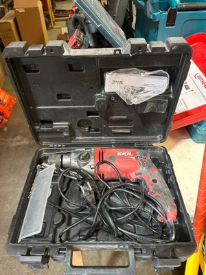 a tool case with tools in it sitting on the floor