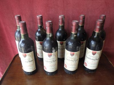 six bottles of wine are lined up on a wooden table