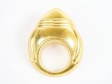 a close up of a gold ring on a white surface