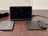 an image of a laptop and other electronics sitting on a table