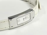 a white leather bracelet with a silver buckle on it