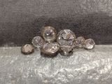 a close up of a bunch of crystal stones on a surface