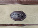 a close up of a bag with a leather patch on it