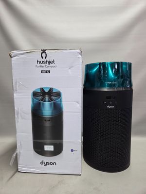 une photo montrant un emballage d'enceinte Bluetooth à côté d'un autre emballage d'enceinte Bluetooth