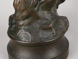 bronze statue of a man and a woman on a rock