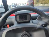 a digital clock on the dashboard of a car